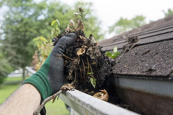 we use a combination of hand scooping and pressure washing for thorough gutter cleaning